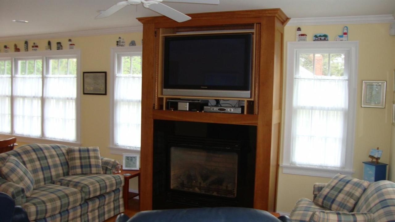 44 Longell Road Dennis Port, MA 02639 - Photo 12 of 35 a living room with furniture and a flat screen tv