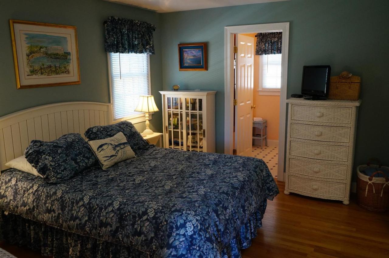 44 Longell Road Dennis Port, MA 02639 - Photo 17 of 35 a bedroom with a bed and wooden floor