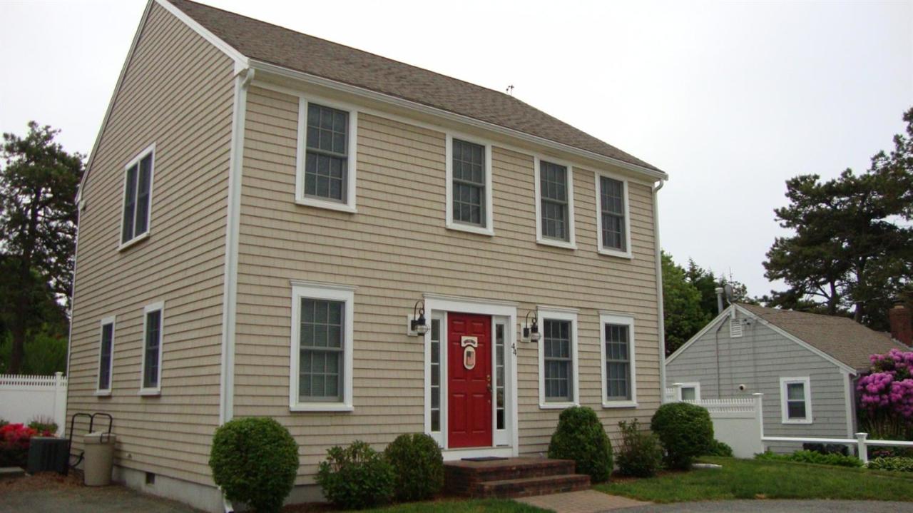 44 Longell Road Dennis Port, MA 02639 - Photo 2 of 35 a front view of a house with garden