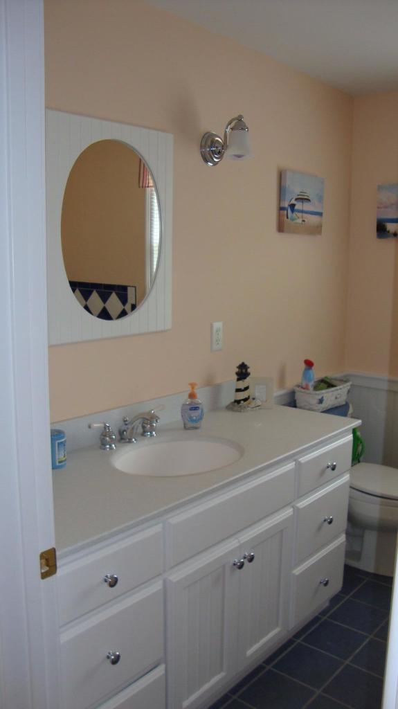 44 Longell Road Dennis Port, MA 02639 - Photo 24 of 35 a bathroom with a double vanity sink and a mirror