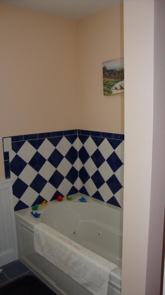 44 Longell Road Dennis Port, MA 02639 - Photo 25 of 35 a bathroom with a black and white checkered floor