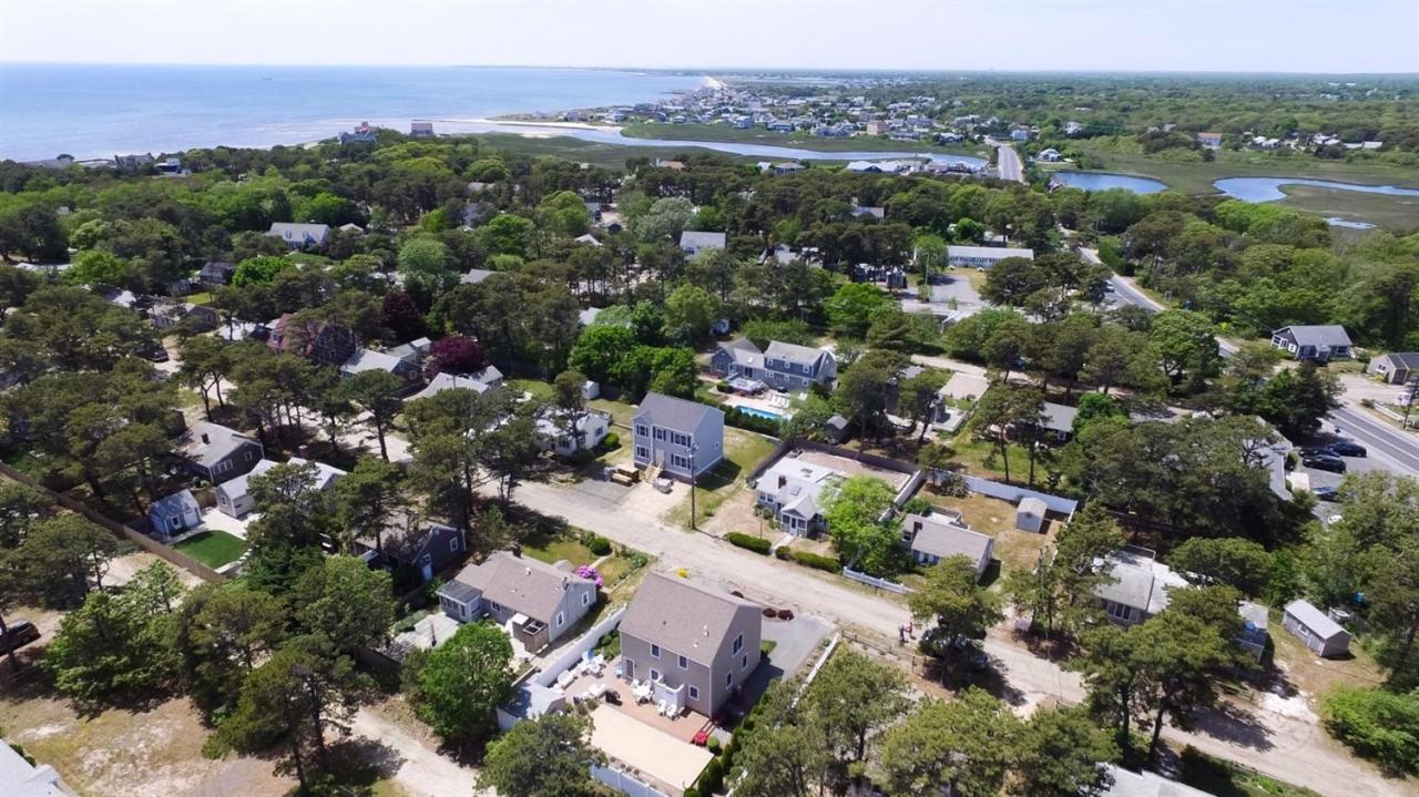 44 Longell Road Dennis Port, MA 02639 - Photo 31 of 35 an aerial view of a city with lots of residential buildings and mountain view in back