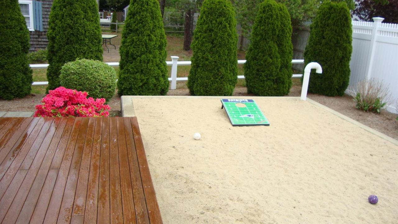 44 Longell Road Dennis Port, MA 02639 - Photo 8 of 35 a view of a swimming pool with a lounge chairs