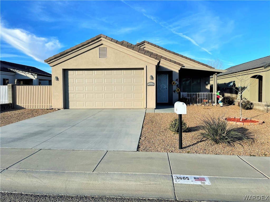 3605 North Kenneth Road Kingman, AZ 86409 - Photo 1 of 28 a front view of a house with yard