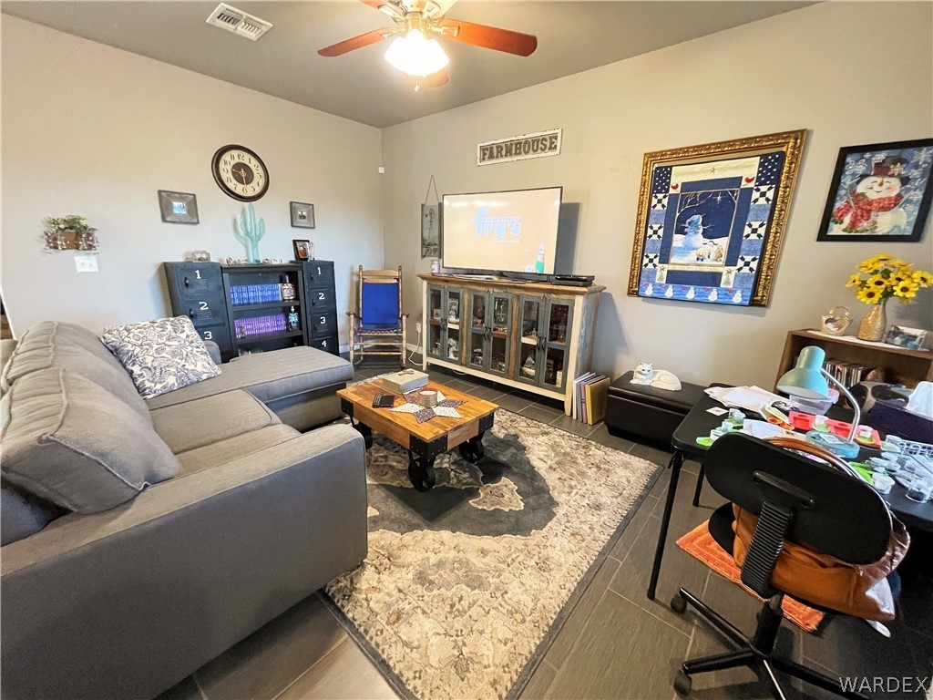 3605 North Kenneth Road Kingman, AZ 86409 - Photo 11 of 28 a living room with furniture and a table