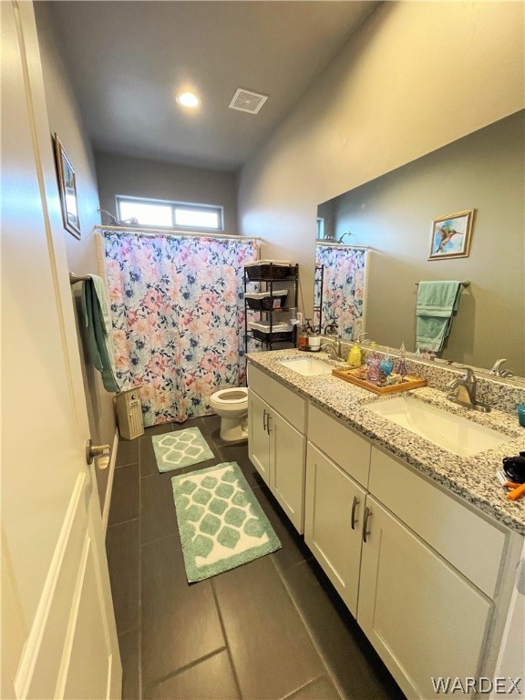 3605 North Kenneth Road Kingman, AZ 86409 - Photo 13 of 28 a kitchen with stainless steel appliances kitchen island granite countertop a sink stove and cabinets