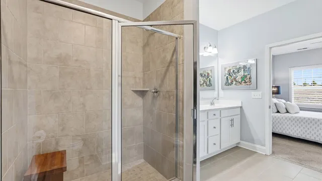 a bathroom with a shower and a sink