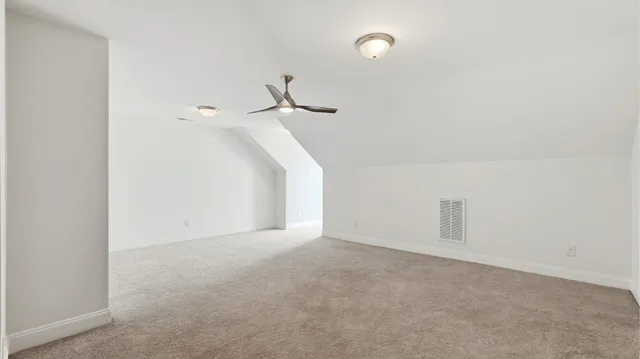 a view of a room with white walls