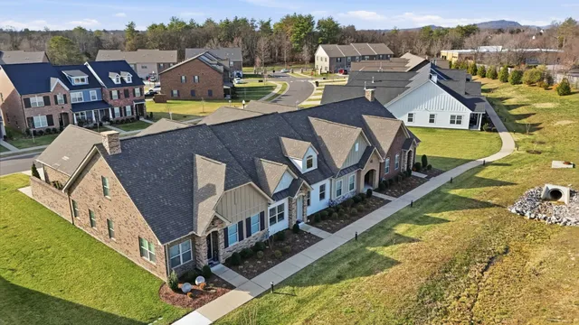a view of a house with roof deck and seating space