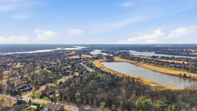 an aerial view of residential building and ocean