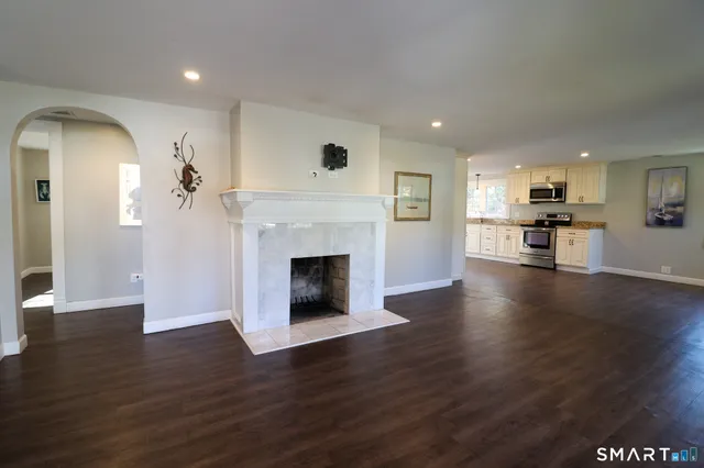 a kitchen with stainless steel appliances a refrigerator and a stove top oven