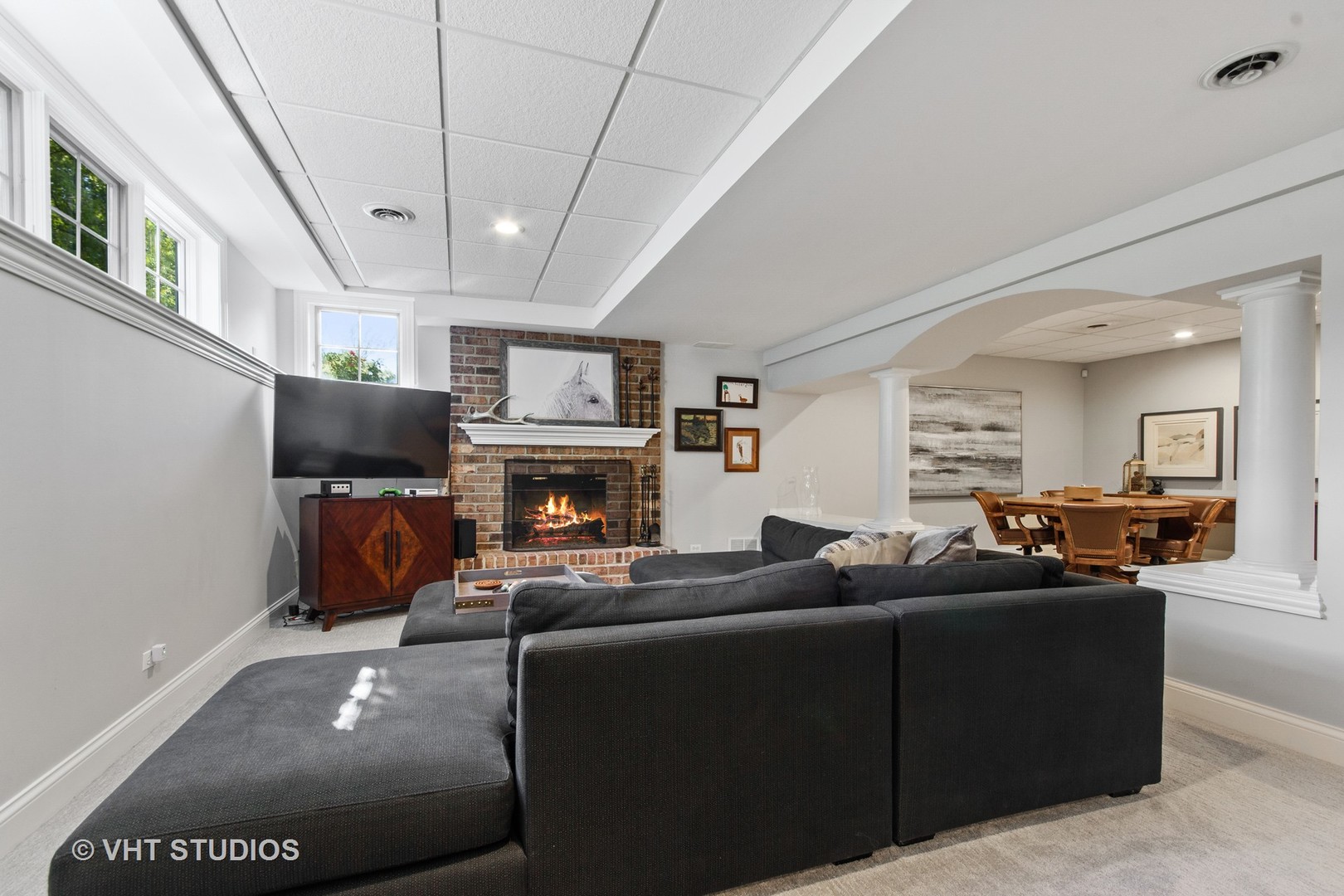 975 Prairie Hill Court Cary, IL 60013 - Photo 19 of 32 a living room with furniture a fireplace and a flat screen tv