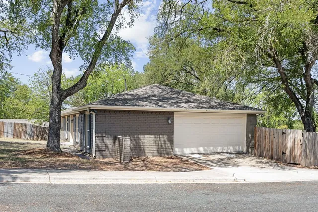 a front view of a house with a garage
