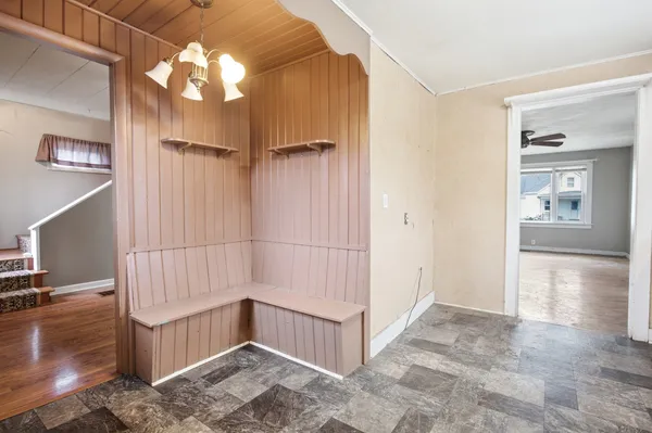 a kitchen with white cabinets and white appliances