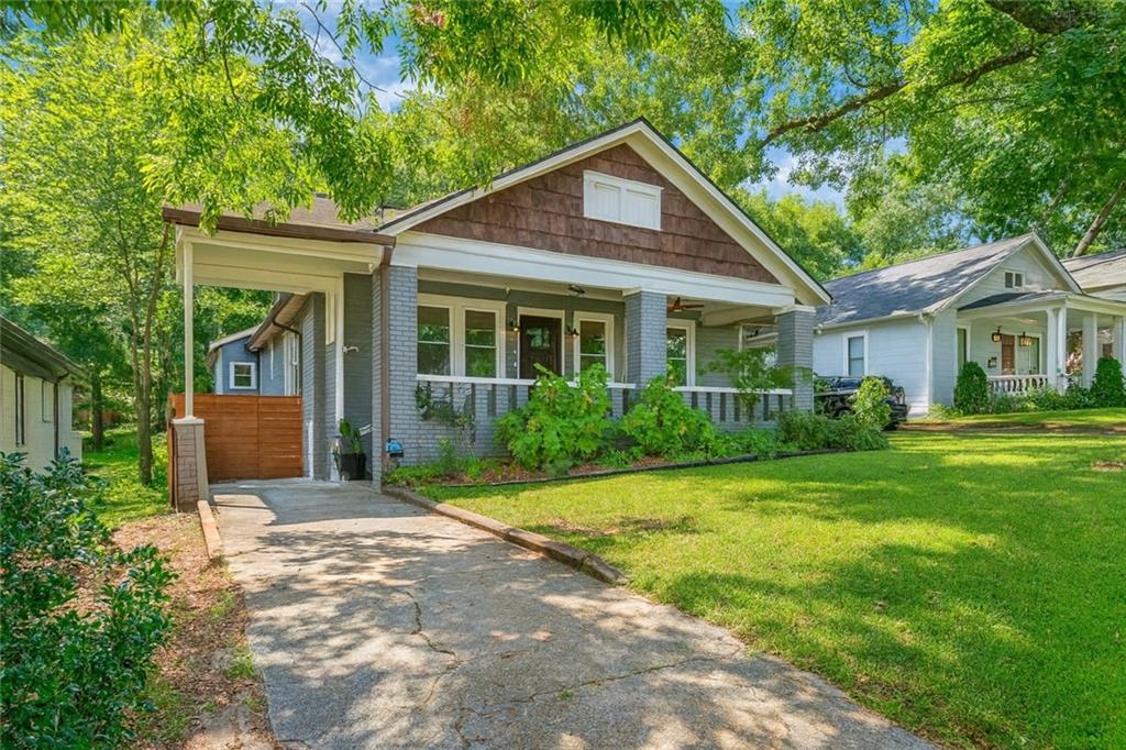 1010 Dill Avenue Southwest Atlanta, GA 30310 - Photo 2 of 39 a front view of a house with a yard and porch