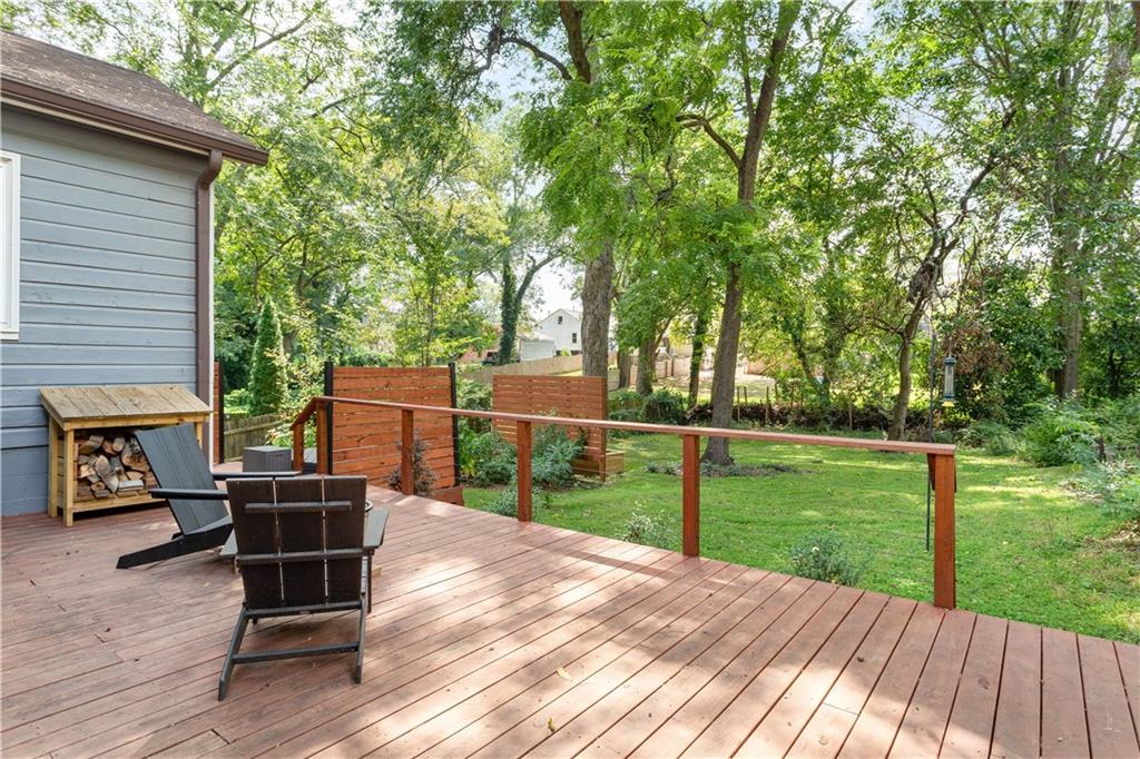 1010 Dill Avenue Southwest Atlanta, GA 30310 - Photo 25 of 39 a view of a deck with table and chairs and wooden floor