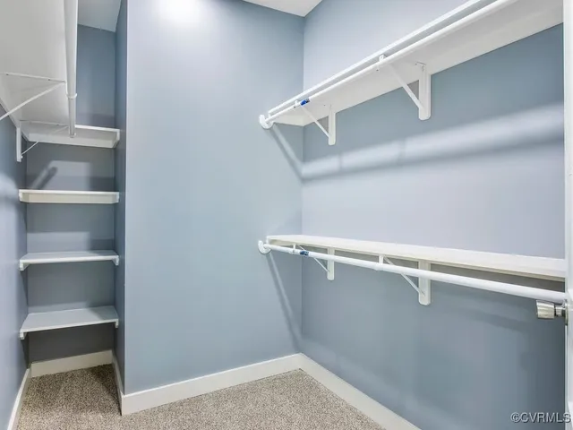 a view of an empty walk in closet