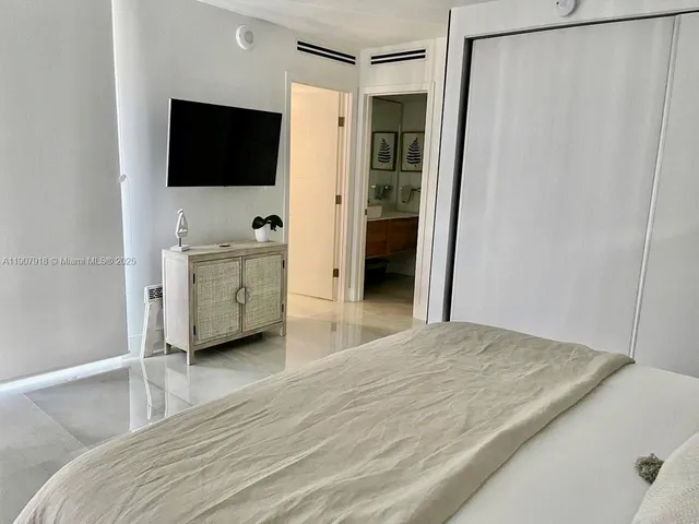 a bed room with a bed and a couch