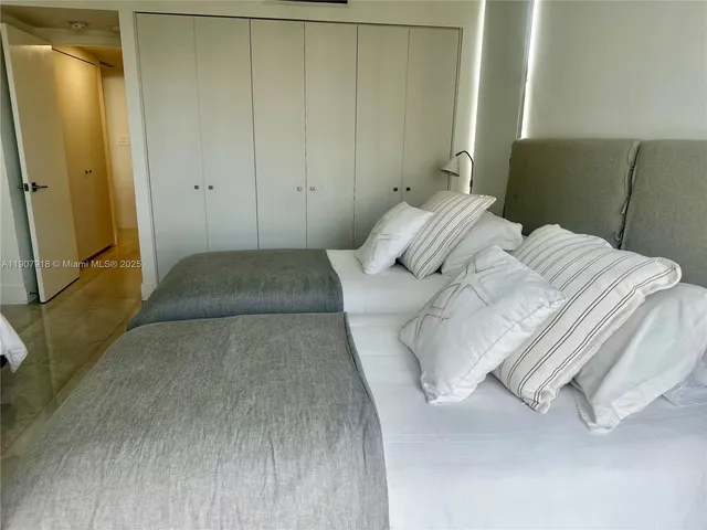 a bathroom with a toilet sink and shower