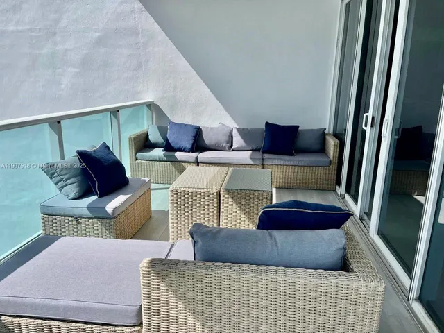 a view of balcony with furniture