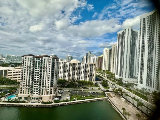 a view of a city next to a lake