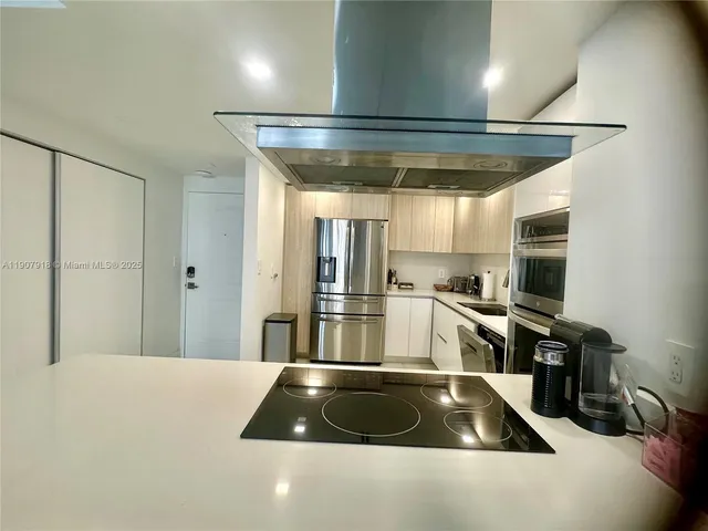 a kitchen with counter top space and stainless steel appliances