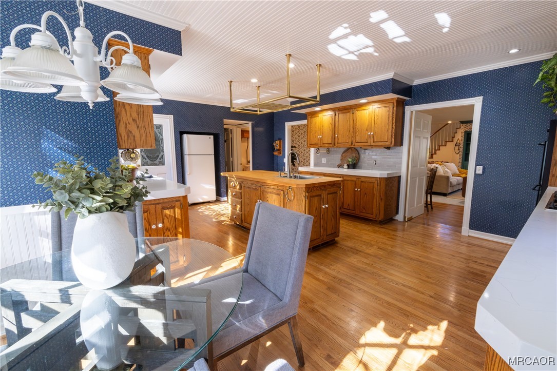 1660 Cascade Road Big Bear City, CA 92314 - Photo 20 of 42 a dining room with furniture a floor to ceiling window and wooden floor