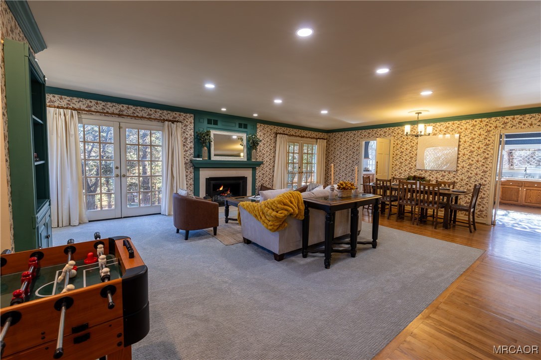 1660 Cascade Road Big Bear City, CA 92314 - Photo 2 of 42 a bed room with furniture and a flat screen tv