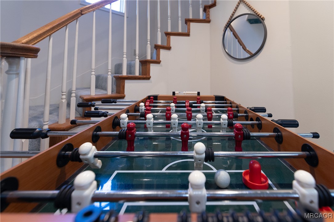 1660 Cascade Road Big Bear City, CA 92314 - Photo 25 of 42 a room with lots of frames on wall and a window