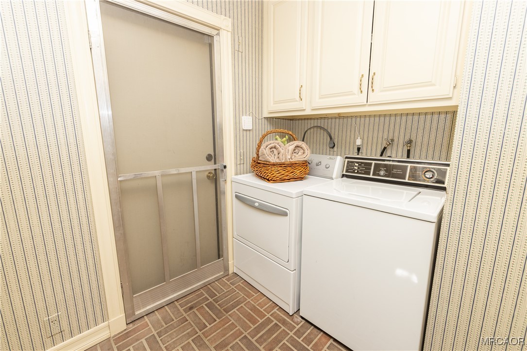 1660 Cascade Road Big Bear City, CA 92314 - Photo 30 of 42 a utility room with dryer and washer