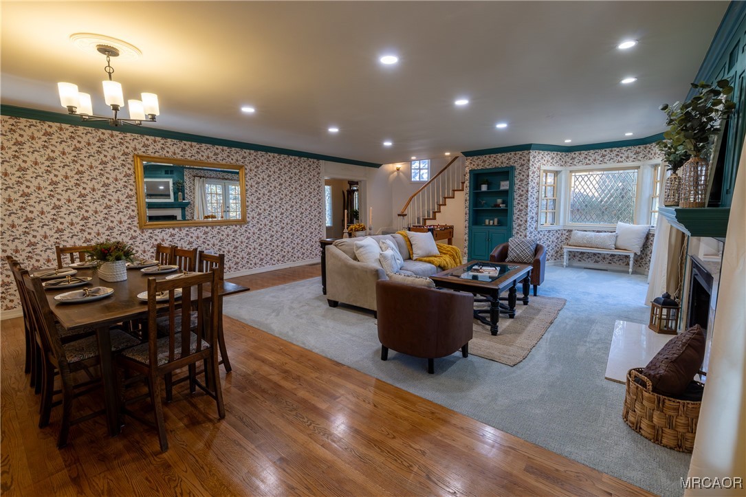 1660 Cascade Road Big Bear City, CA 92314 - Photo 3 of 42 a living room with furniture a flat screen tv and a dining table