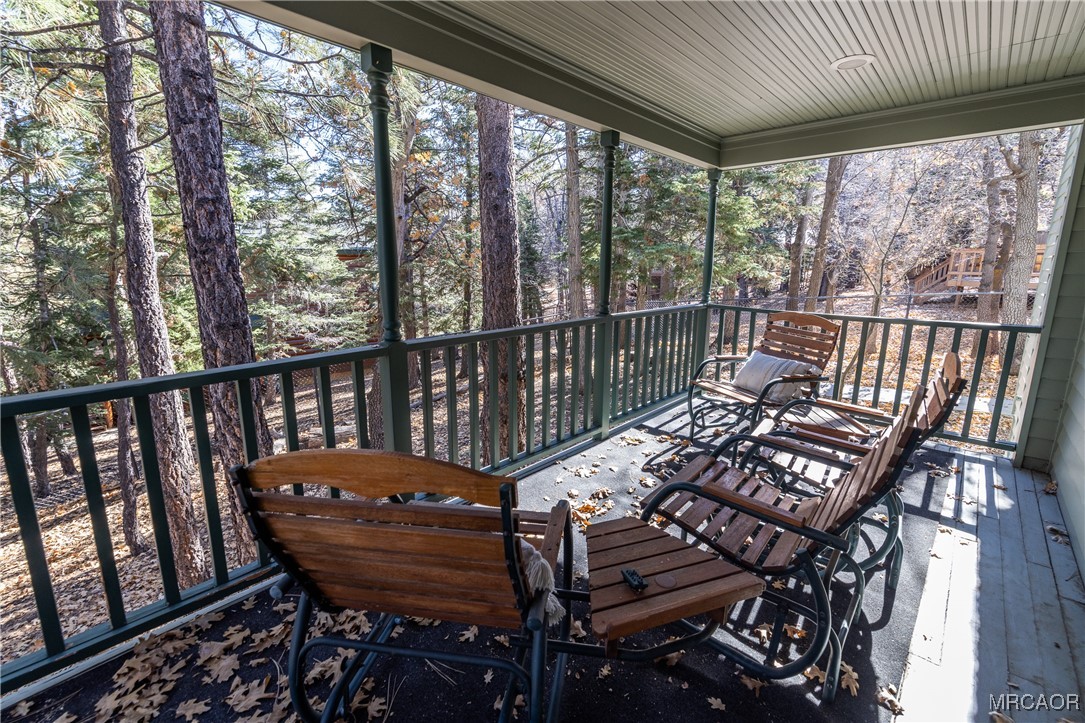 1660 Cascade Road Big Bear City, CA 92314 - Photo 41 of 42 a view of a balcony with wooden floor