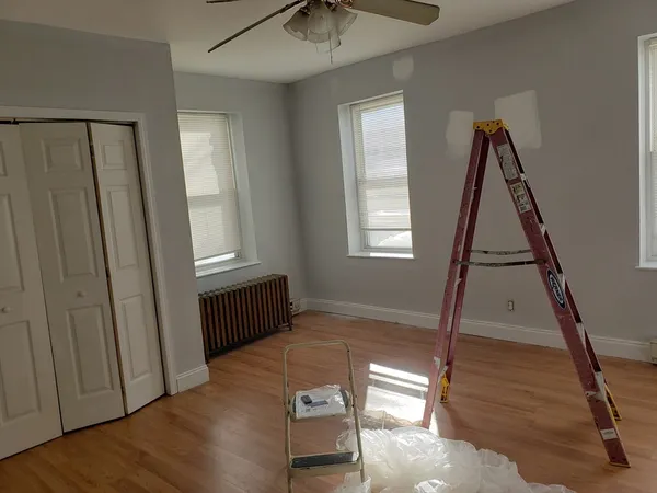 a view of an entryway with wooden floor