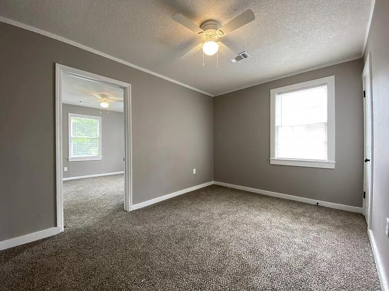 247 Modder Avenue Memphis, TN 38109 - Photo 7 of 8 a view of an empty room with a window