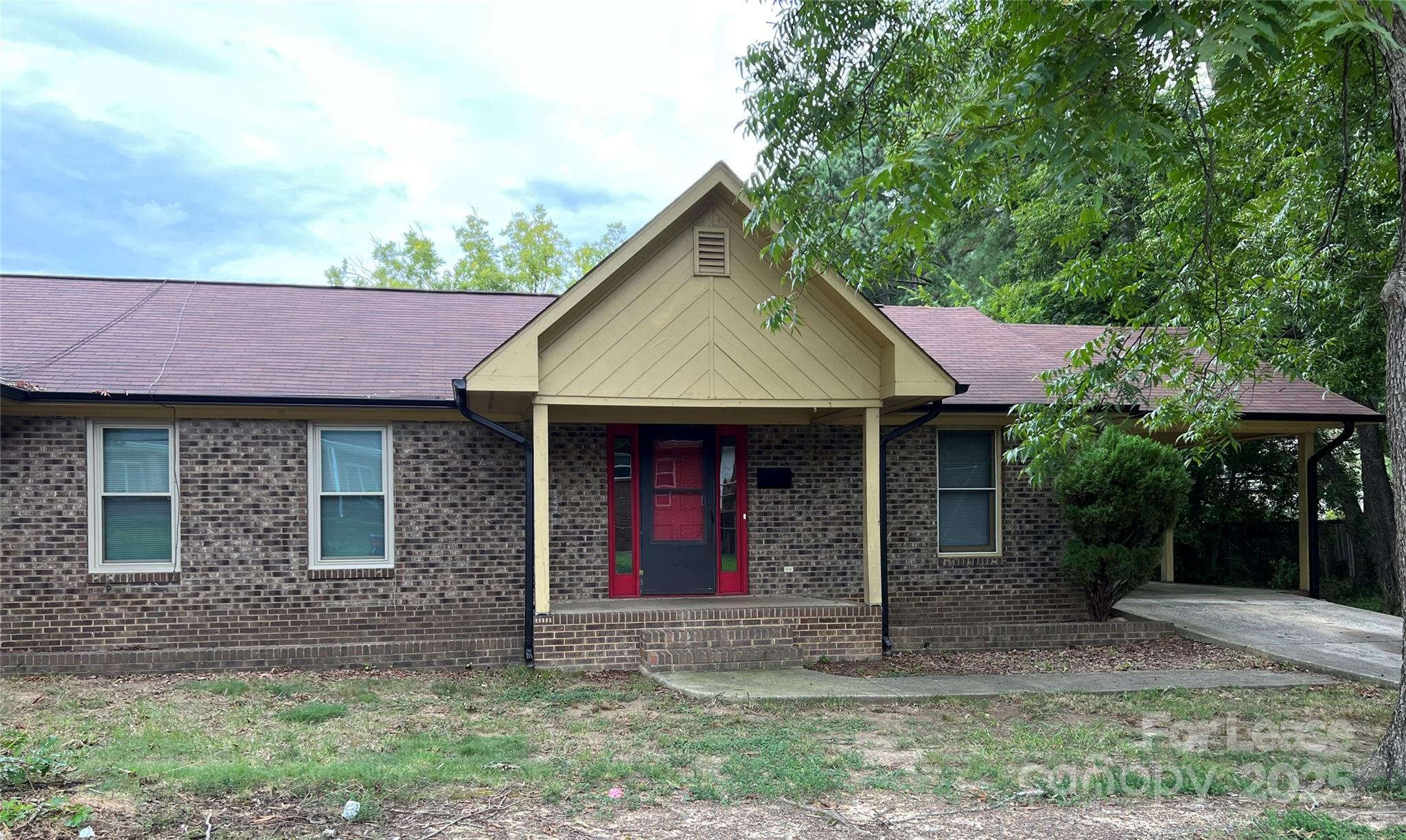 120 West Hudson Street Monroe, NC 28112 - Photo 1 of 9 a front view of a house with garden