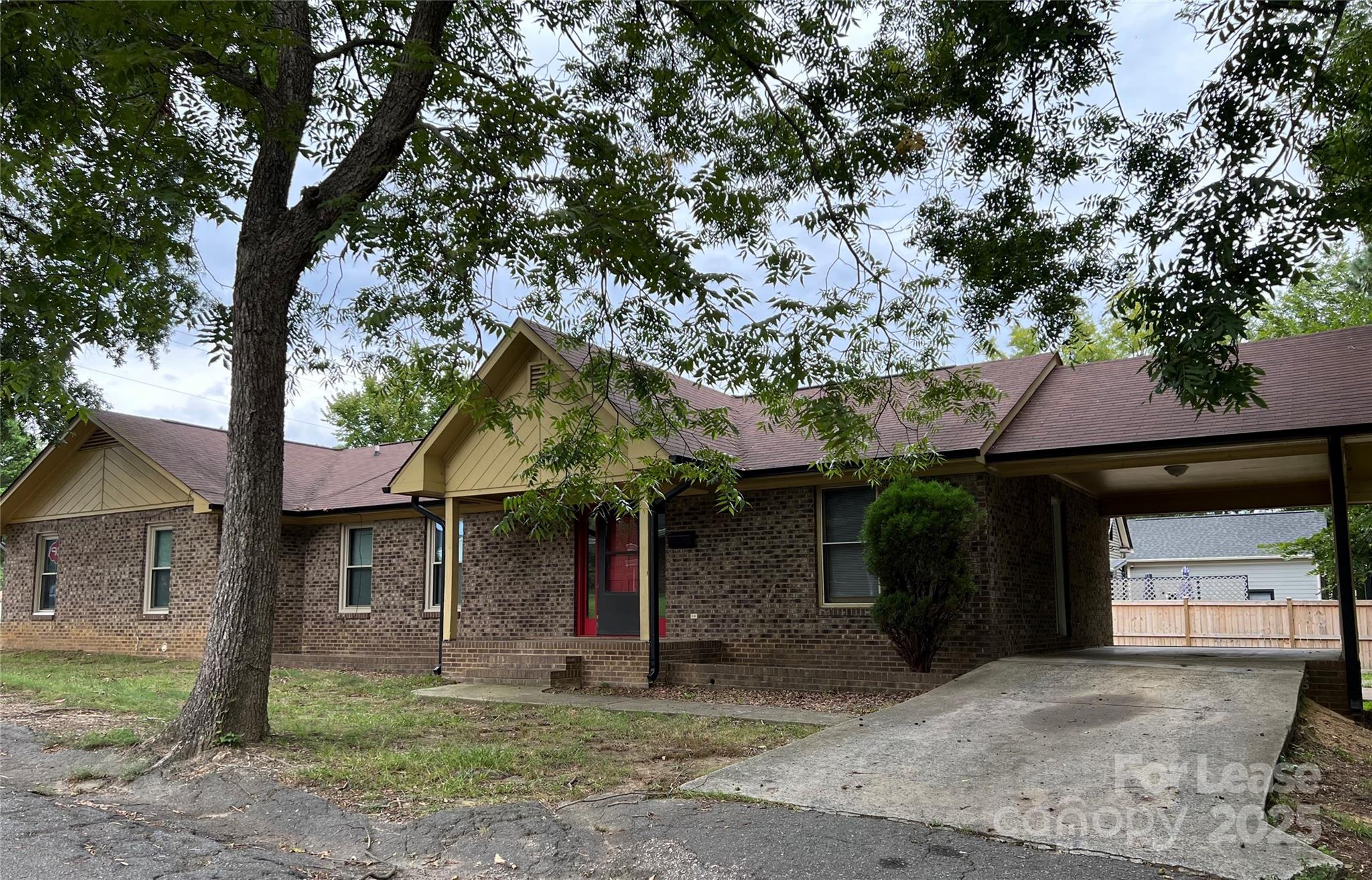 120 West Hudson Street Monroe, NC 28112 - Photo 2 of 9 a view of a house with a tree and a yard