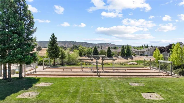 a swimming pool with outdoor seating and yard