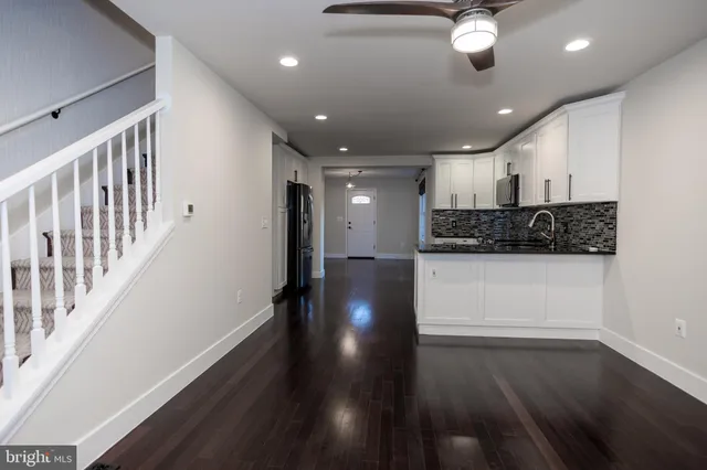 a view of gallery with wooden floor
