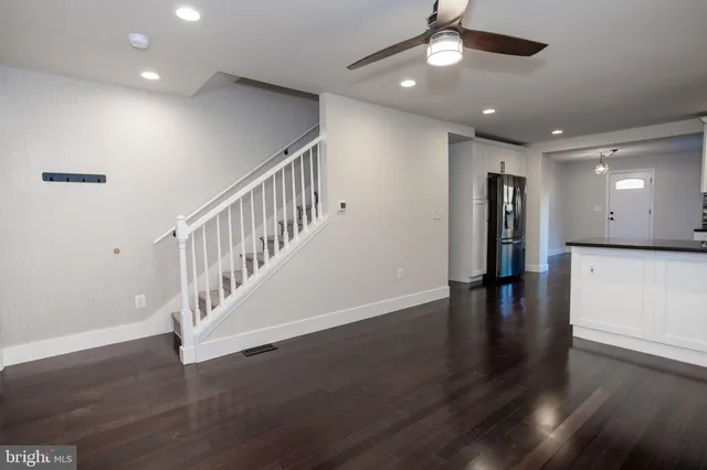 a view of an entryway with wooden floor