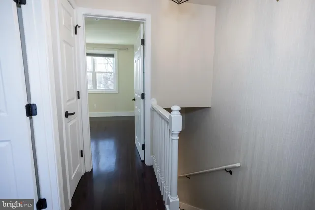a view of a bathroom from a hallway