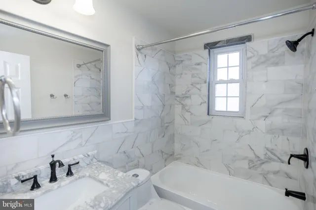 a bathroom with a sink and a bathtub