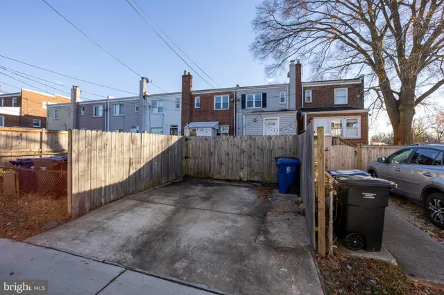 a view of a parking space in backyard