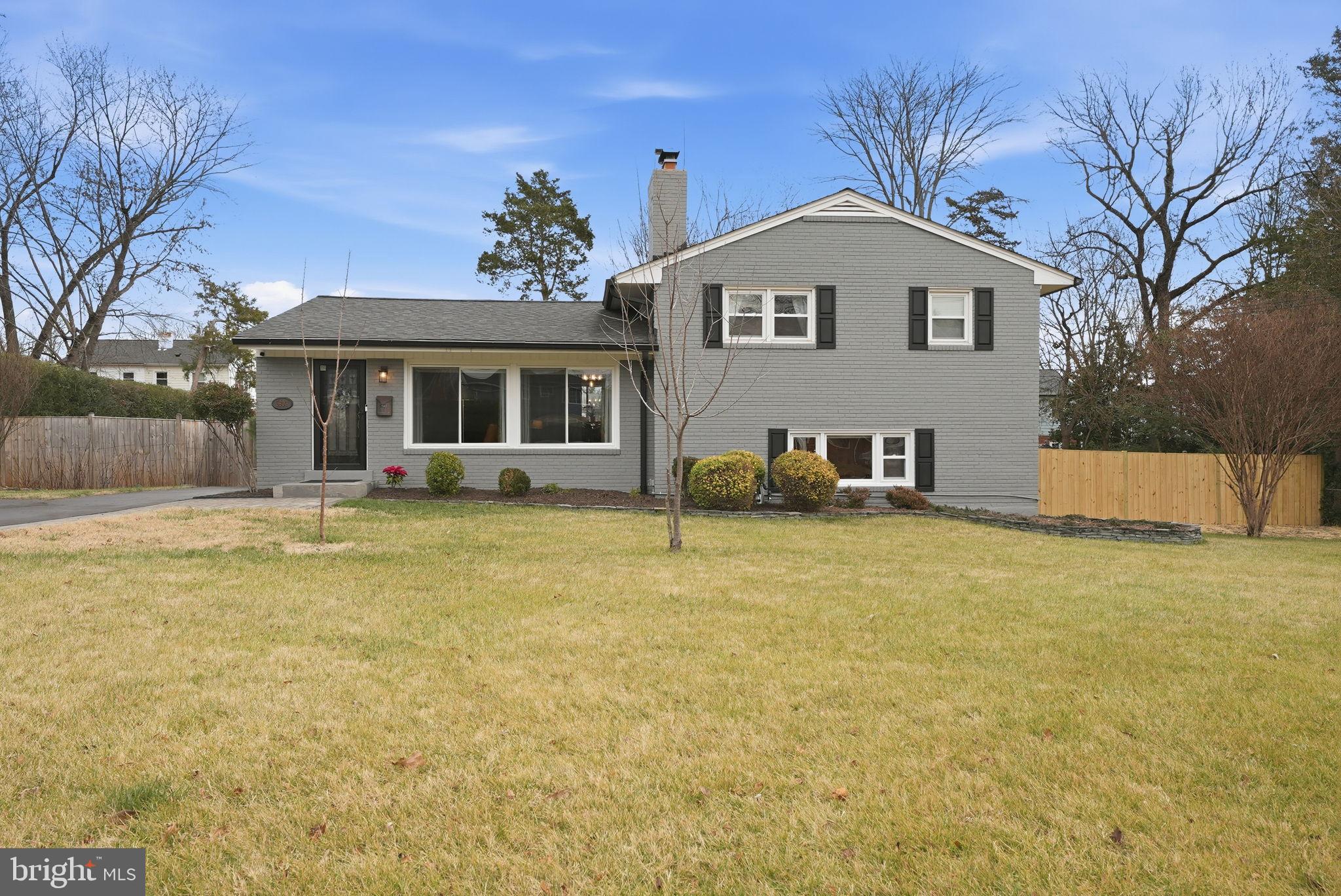 6803 Derrell Court Alexandria, VA 22307 - Photo 1 of 43 a front view of a house with a yard