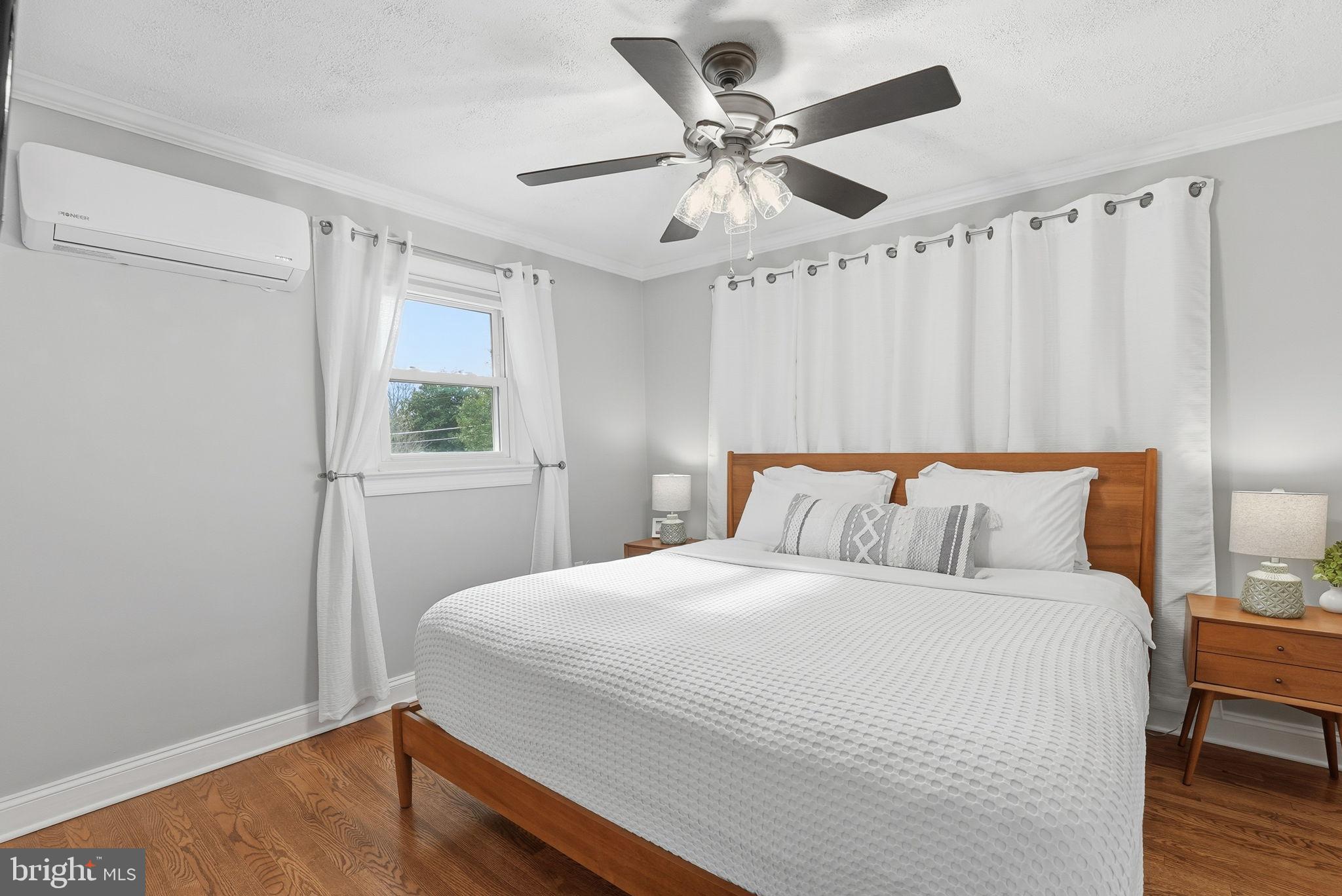 6803 Derrell Court Alexandria, VA 22307 - Photo 16 of 43 a bedroom with a bed and a window