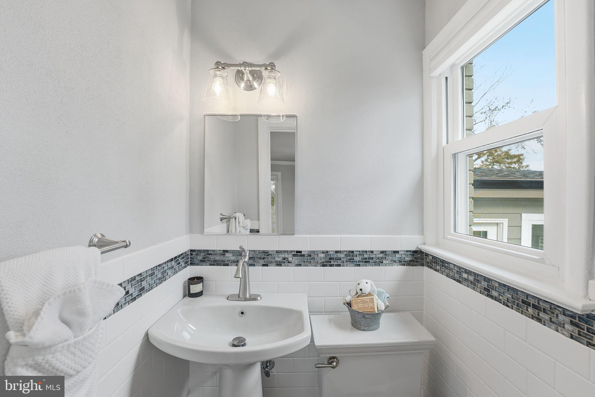 6803 Derrell Court Alexandria, VA 22307 - Photo 23 of 43 a bathroom with a sink and a mirror
