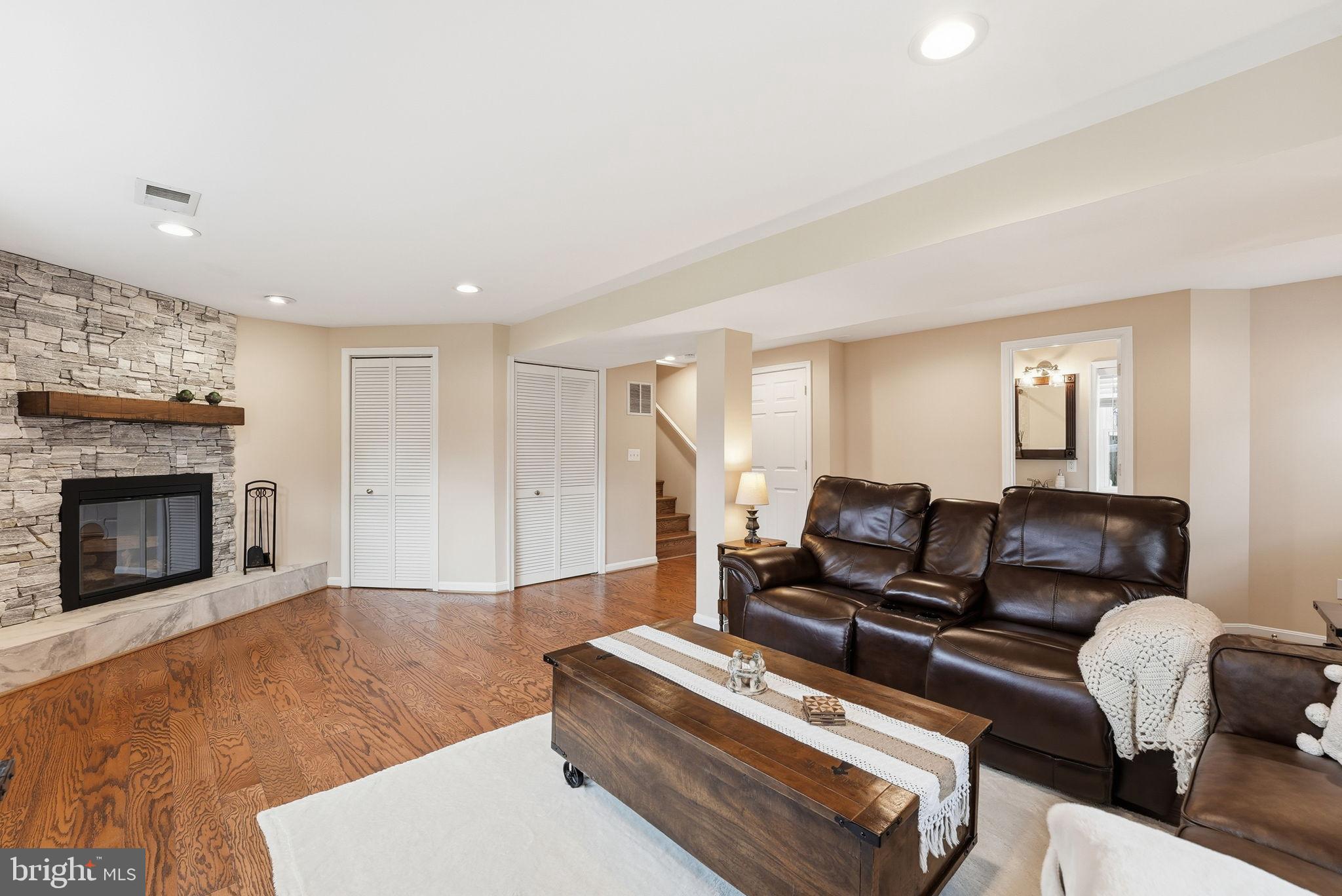 6803 Derrell Court Alexandria, VA 22307 - Photo 25 of 43 a living room with furniture and a fireplace