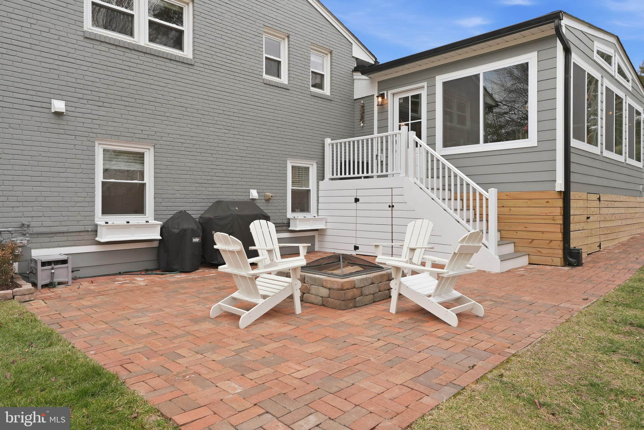 6803 Derrell Court Alexandria, VA 22307 - Photo 32 of 43 a view of a patio with couches chairs and wooden floor