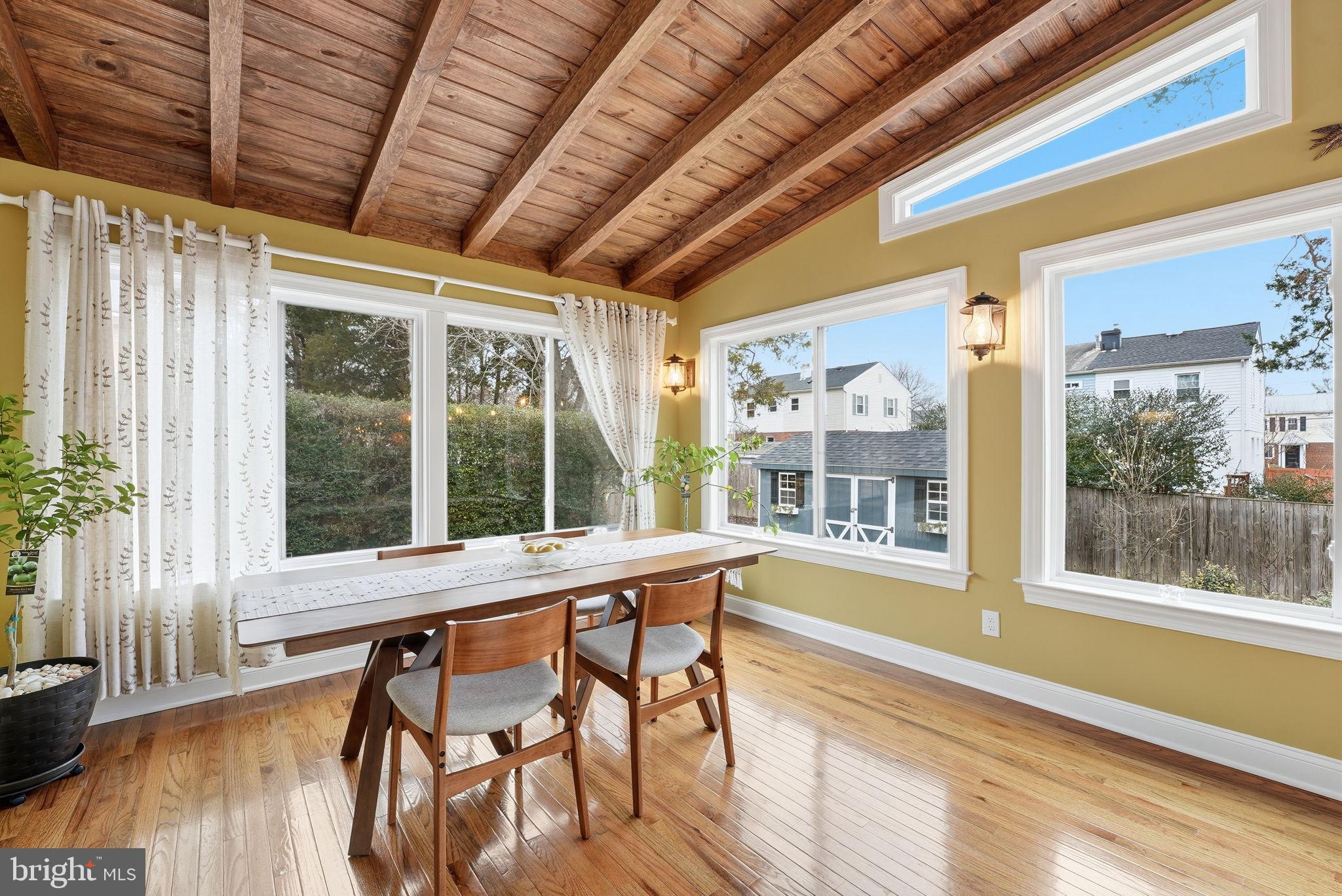 6803 Derrell Court Alexandria, VA 22307 - Photo 9 of 43 a view of a room with furniture large windows and wooden floor