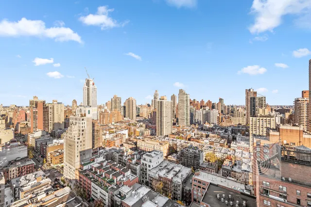 a view of a city with tall buildings