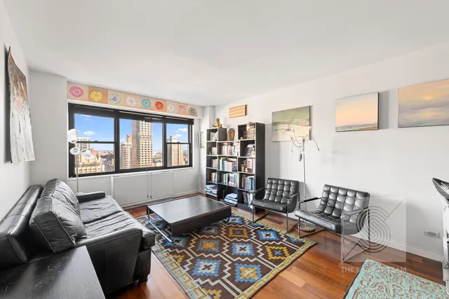 a living room with furniture and a rug